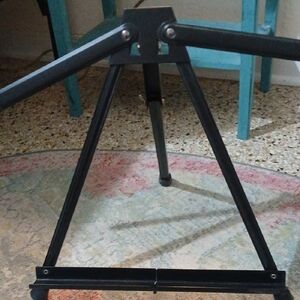 Sleek Black Metal Artist Stand